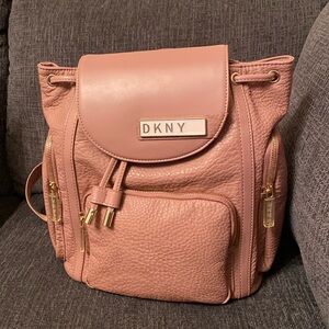DKNY backpack with round pouch included. New, never used.